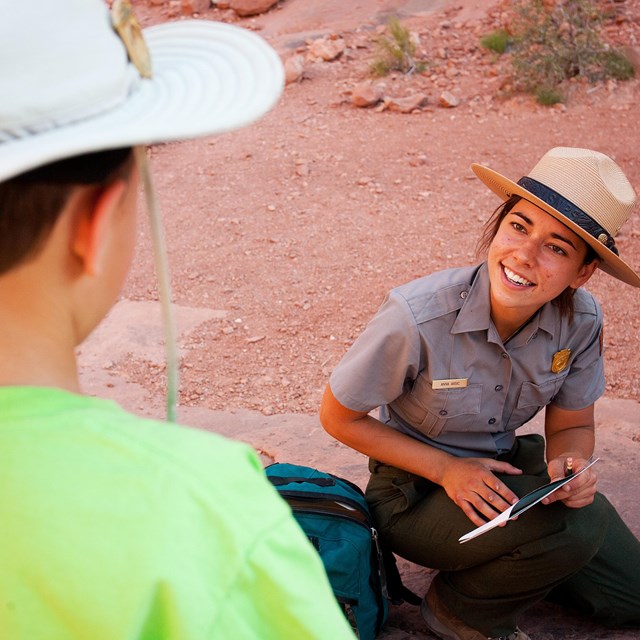 a ranger speaks with a child