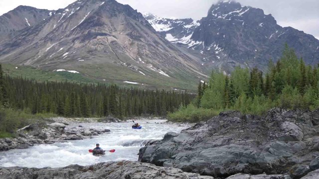 Pack rafters go down whitewater in the Brooks Range.