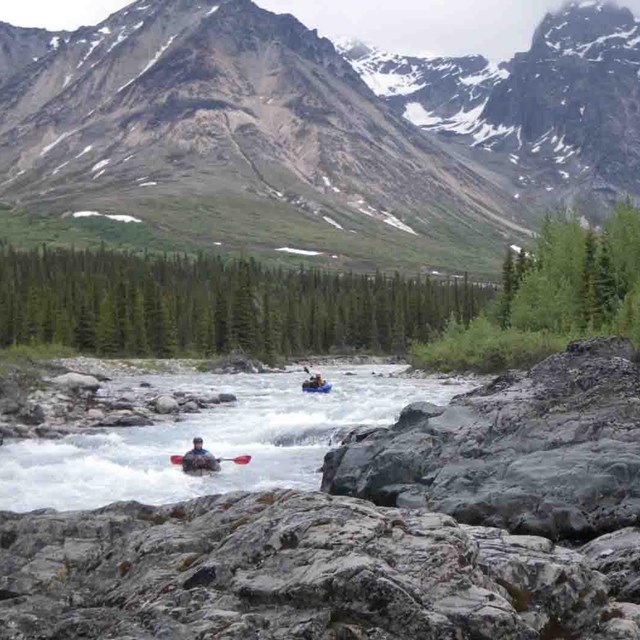 Pack rafters go down whitewater in the Brooks Range.