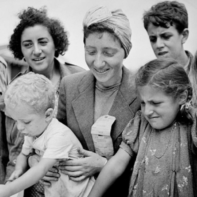 greyscale image of women and children from the 1940s looking down