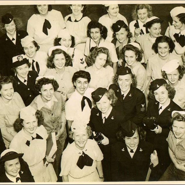 Black and white photo of women in uniforms shot from above