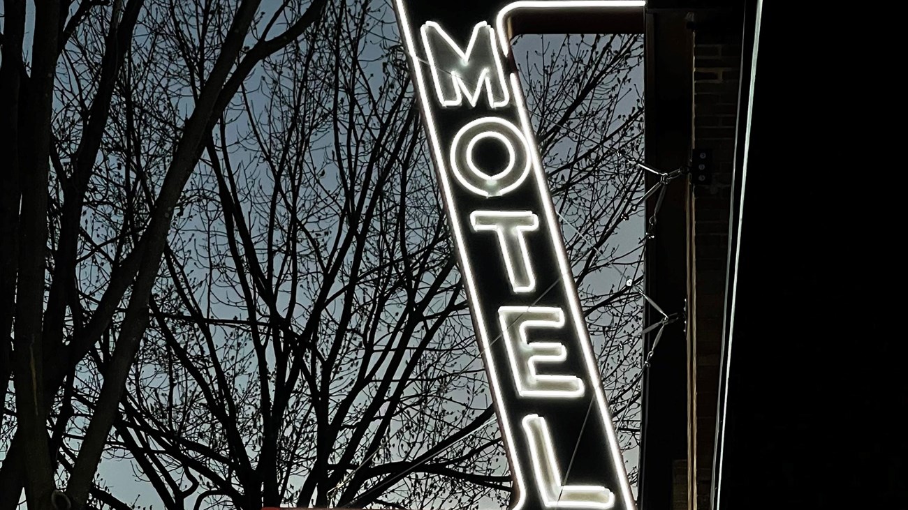 AG Gaston Motel sign lit up at night.