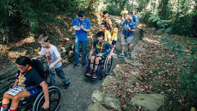 Wheelchair users and hikers share a trail while exploring Buffalo National River.