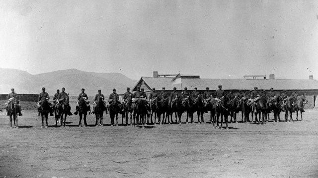 Several african american mounted soldiers in formation