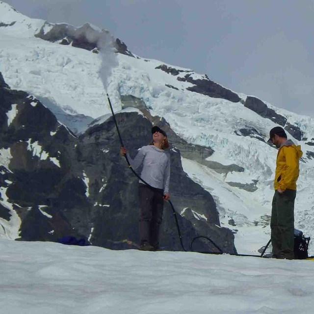 Researchers measure the mass of a glacier.