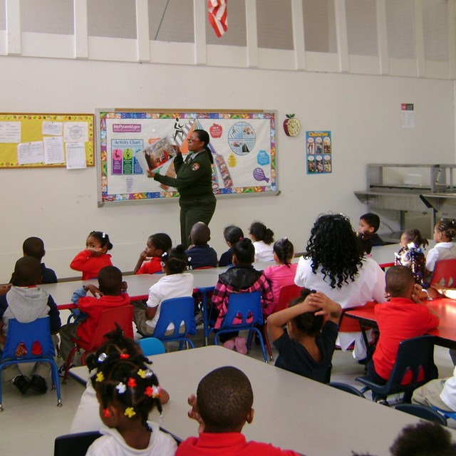 Ranger stands before classroom teaching