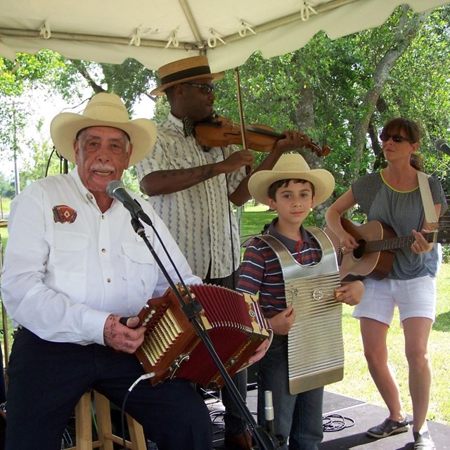 people playing instruments on stage.