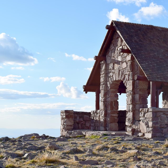 Open air stone structure on a hill top.