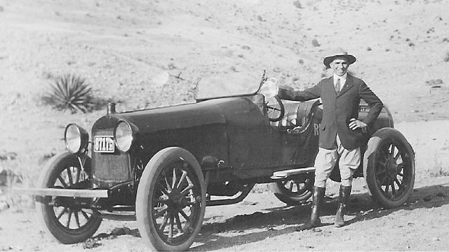 Man and old fashioned car. 