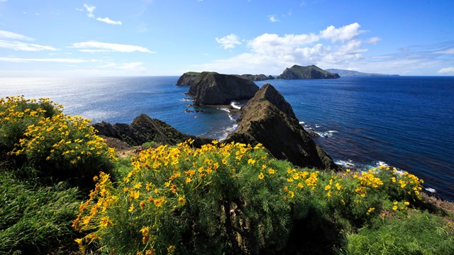 Three islets surrounded by blew water. ©Tim Hauf, timhaufphotography.com