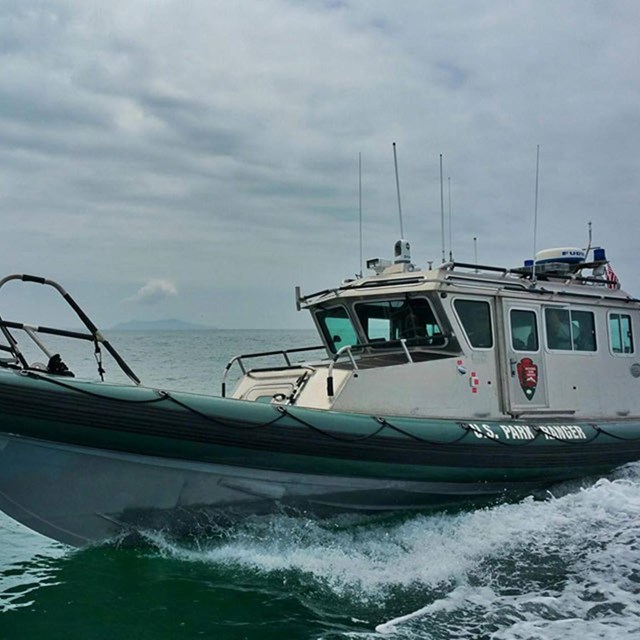 small boat with rubber tail and steel wheelhouse