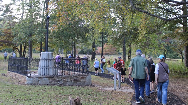 Visitors walking around the Washington Light Infantry Monument 