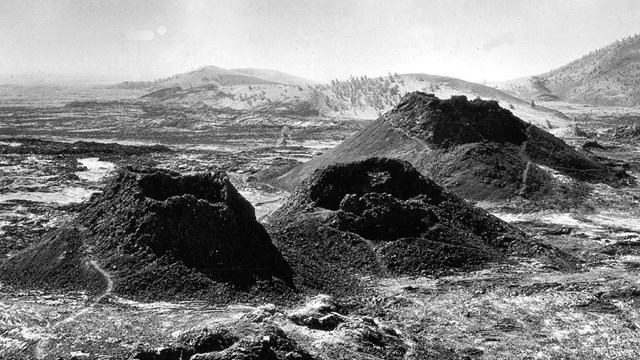 Three spatter cones in a lava field. 