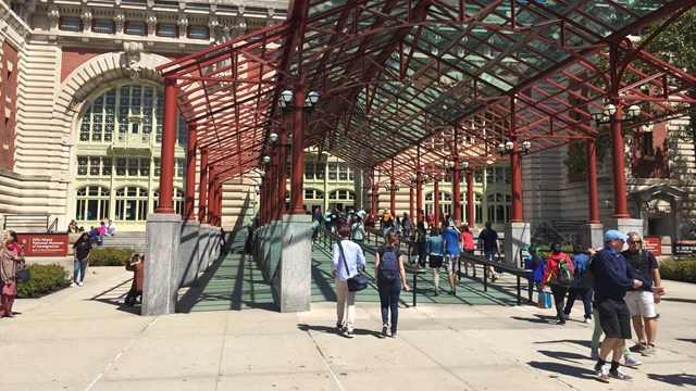 A long ramp leading to the entrance of Ellis Island's Main Building.