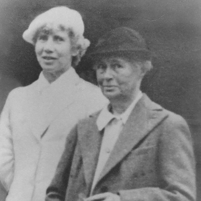 A portrait photograph of two women wearing jackets.