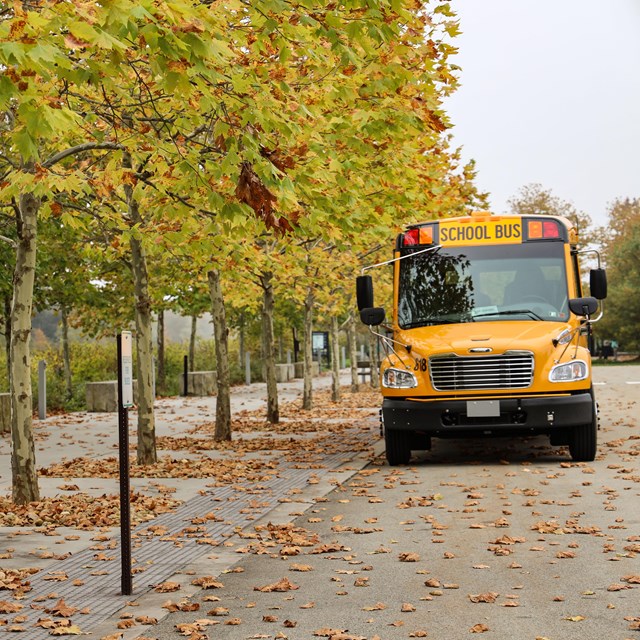 Students walking on sidewalk to overlook.