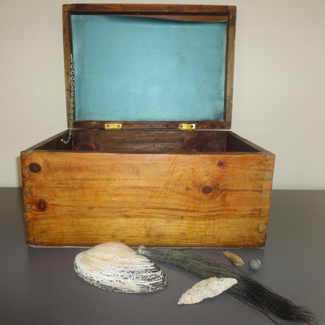 Image of open wooden trunk.