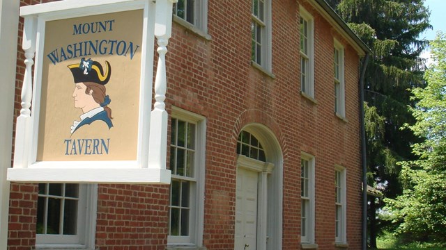 The two story brick building with sign