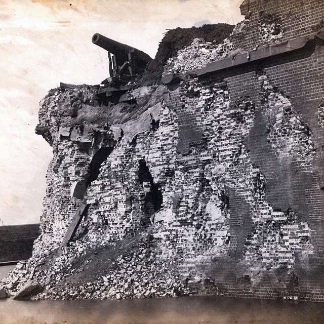 Black and white image of the battered brick walls of Fort Pulaski.