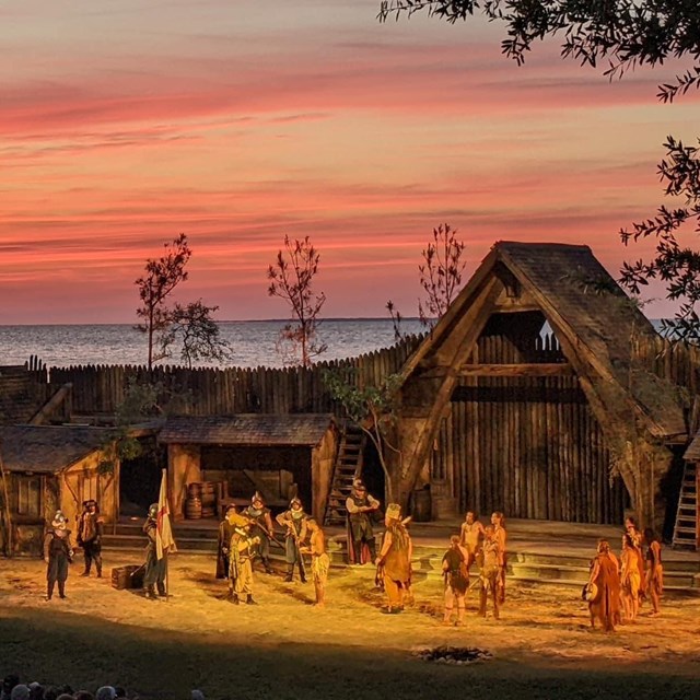 Actors portraying Natives and English soldiers in an outdoor theatre