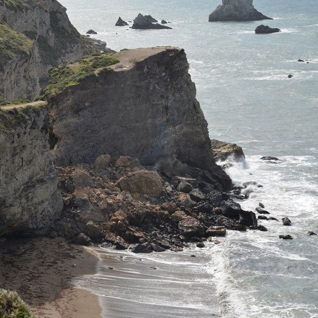 eroding bluffs on narrow beach