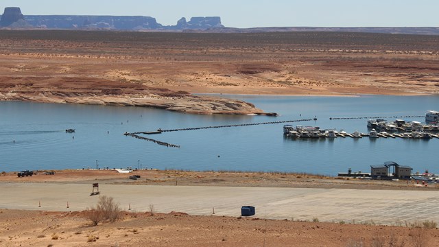 A boat launch ramp on a desert lake.