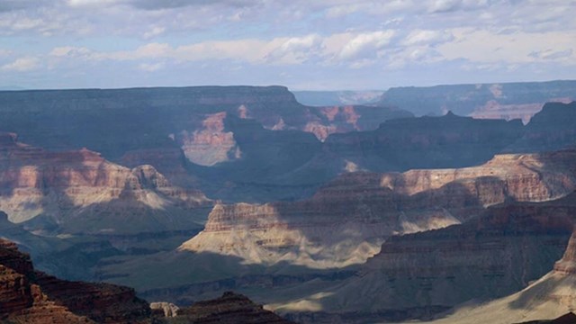 view from webcam on a cloudy day. areas of light and shadow across the landscape.