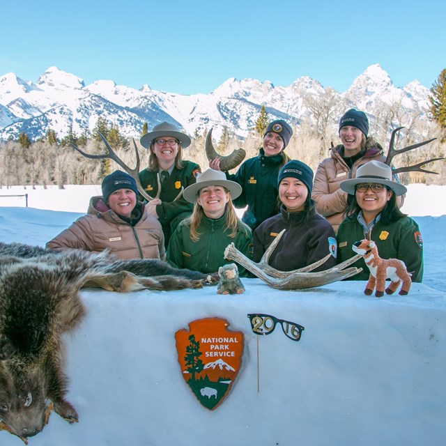 Rangers Behind Snow Desk