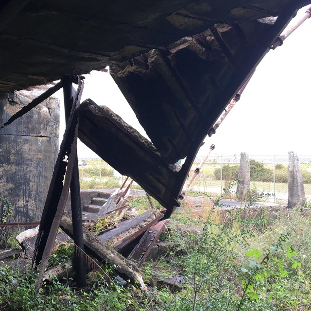 Concrete platform falls from an elevated position.