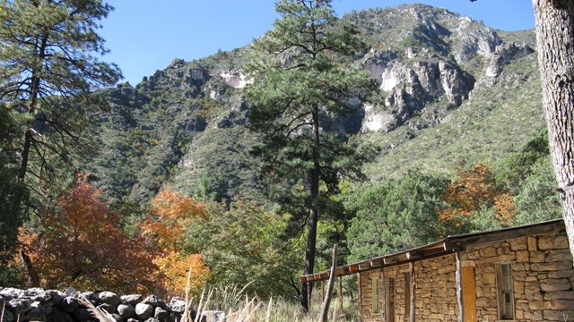 A stone shack in a mountain environment