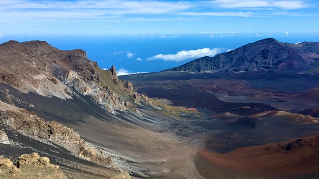 crater view with colorful cinders and a bright blue sky