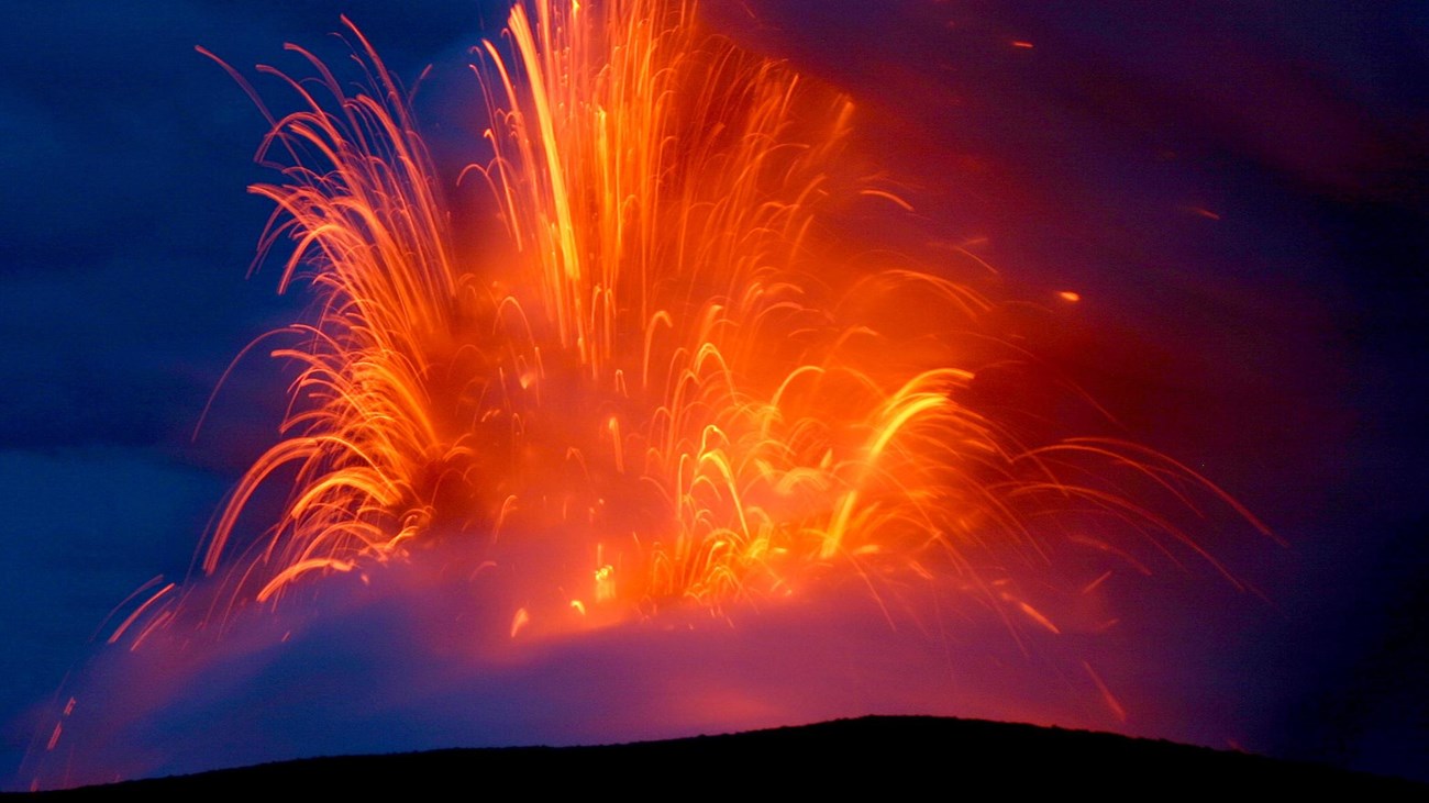 Molten lava spraying out of a fissure