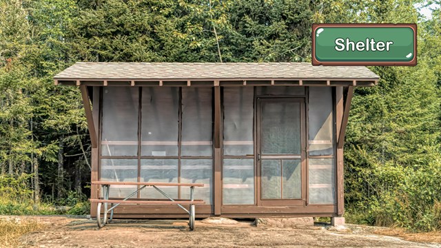 A wooden shelter in a campground.