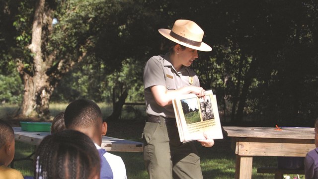 School children listening to the park ranger at the Boyhood Farm