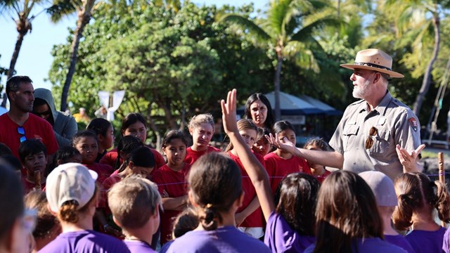 Park ranger addressing crowd of students