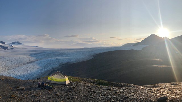 A tent with icefield in background