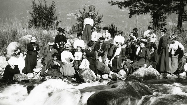 Ladies picnic along a river