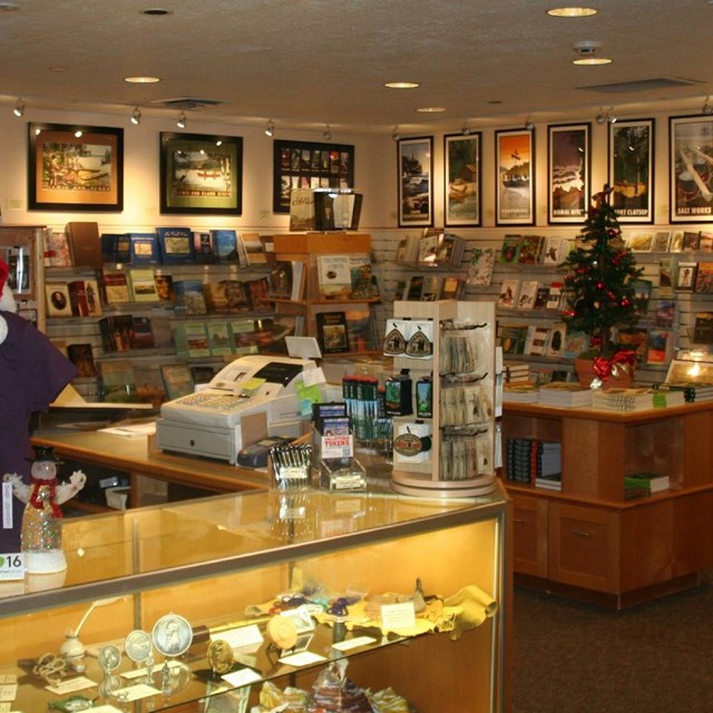 Fort Clatsop Bookstore and glass check out counter with cash registers.