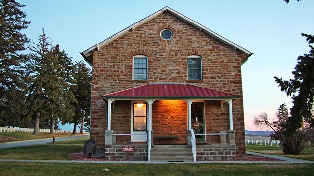 Stonehouse entrance way with Custer National Cemetery in the background.