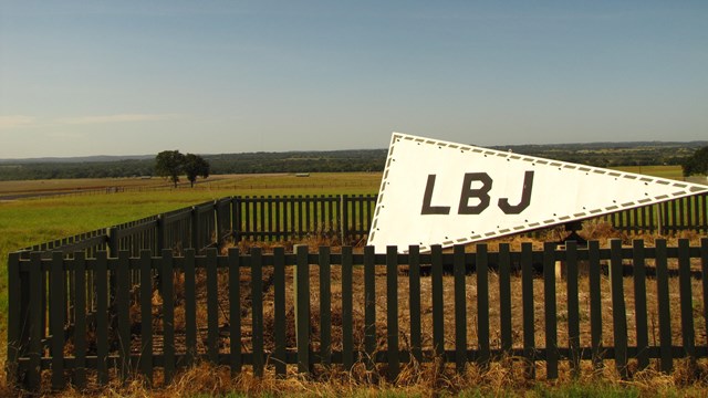 A tetrahedron (air directional marker for the airstrip) sits atop a hill.