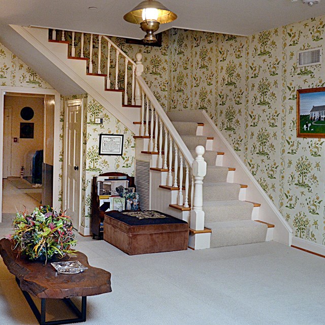 Stairs from the den lead up to the second floor of the Texas White House.
