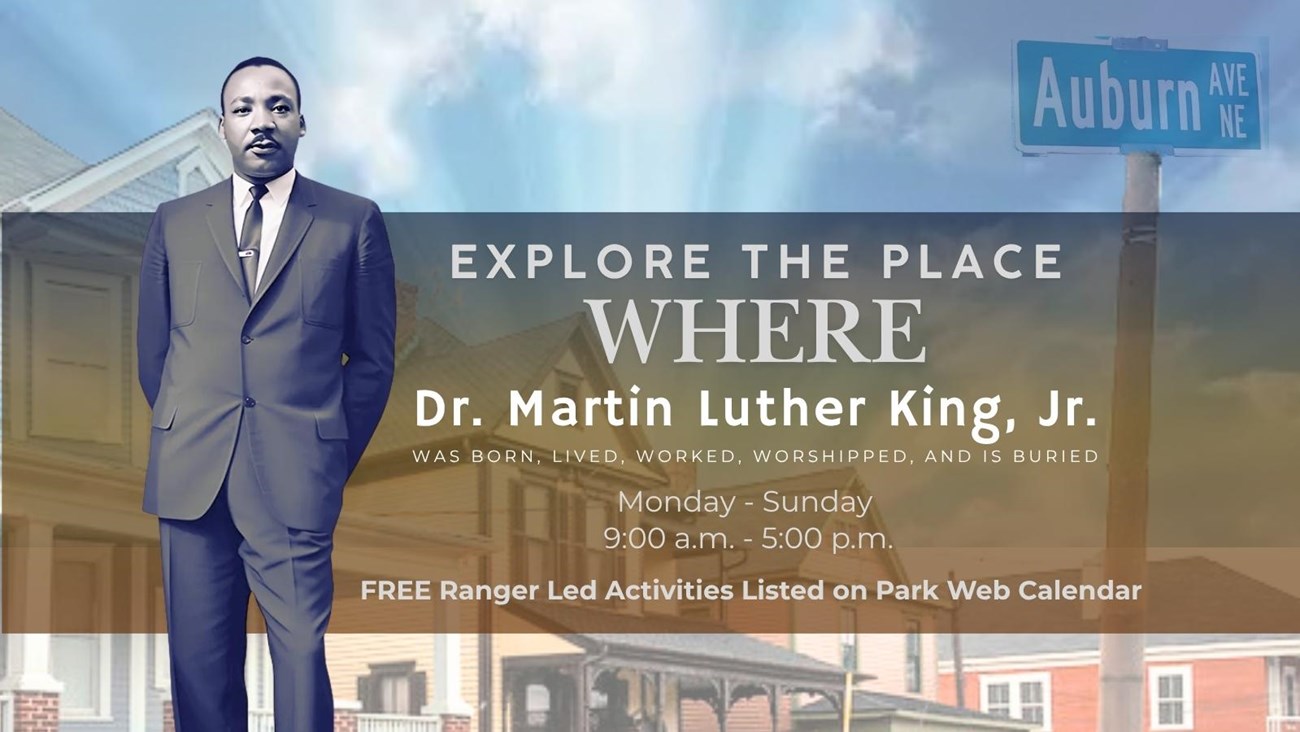 Standing Photograph of Martin Luther King, Jr. with Birth Home Block in Background