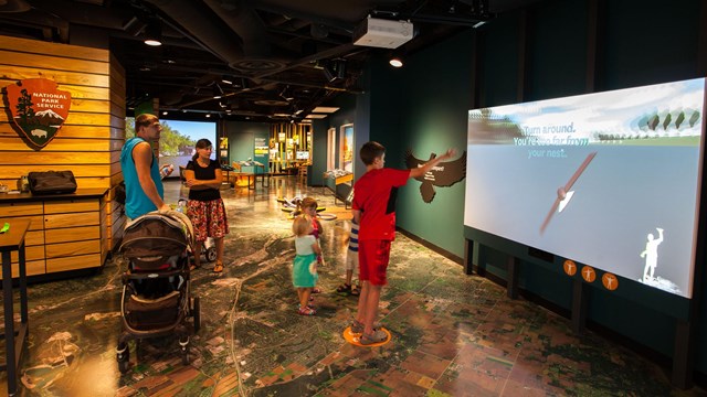 People working with indoor exhibits.