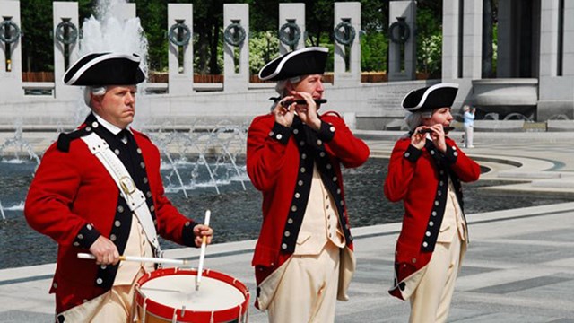 Drum and Fife re-enactors playing at the World War II Memorial