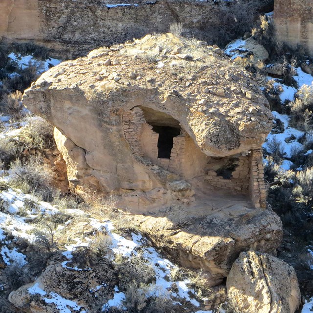 Dwelling built into freestanding boulder