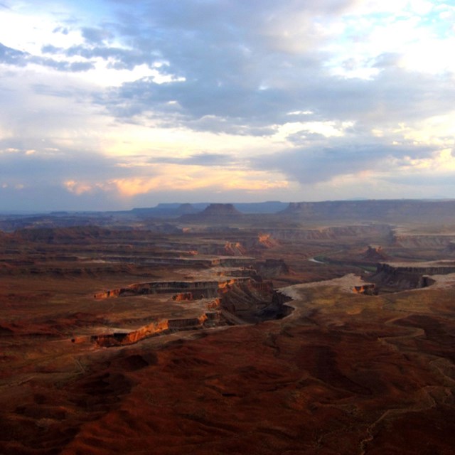 Evening sunlight over vast canyon