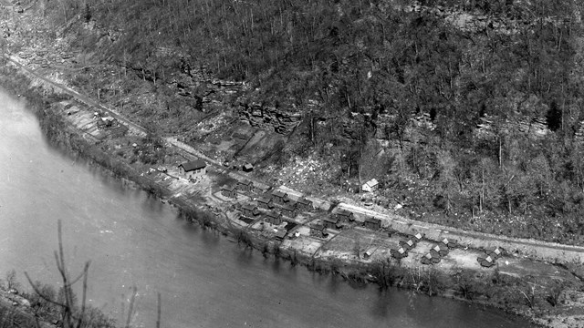 A small town sitting next to a river viewed from the air