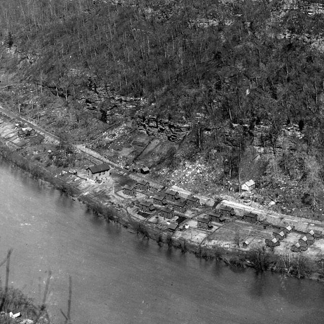 A small town sitting next to a river viewed from the air