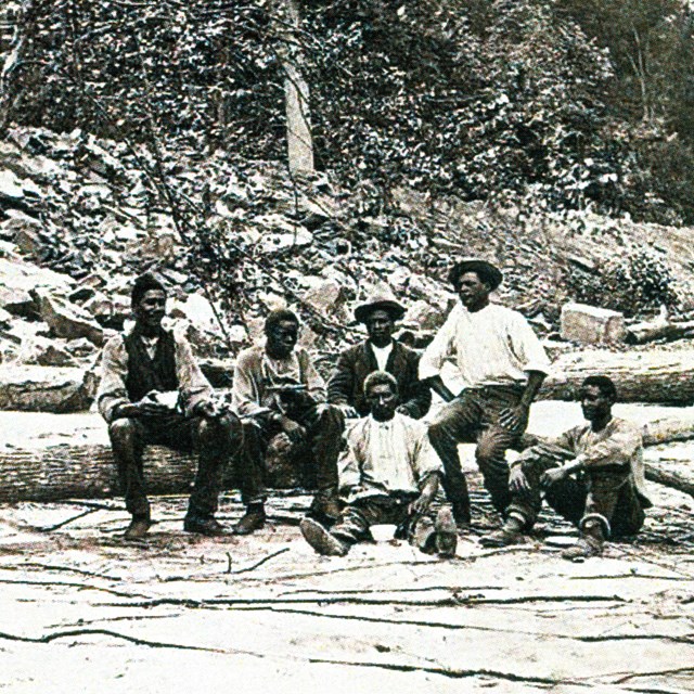 black and white photo of African American boatmen