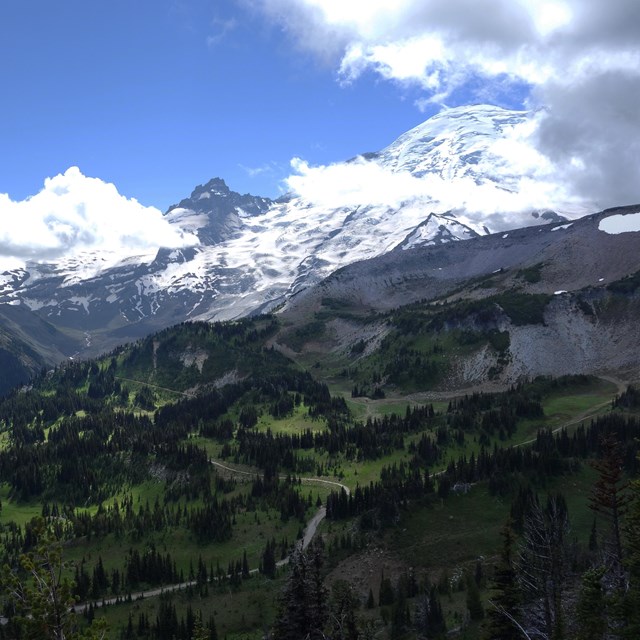 View of mountains partly cloaked in clouds